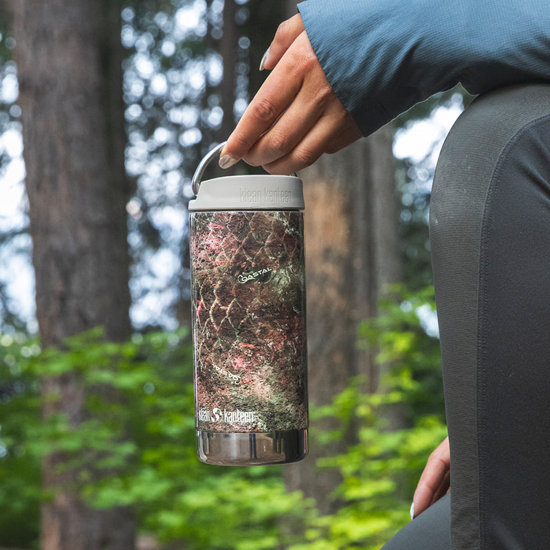12oz-tkwide-with-twist-cap-mossy-oak-b9 12oz_tumbler_mossyoak_rainbowtrout_hand_closeup_square.jpg