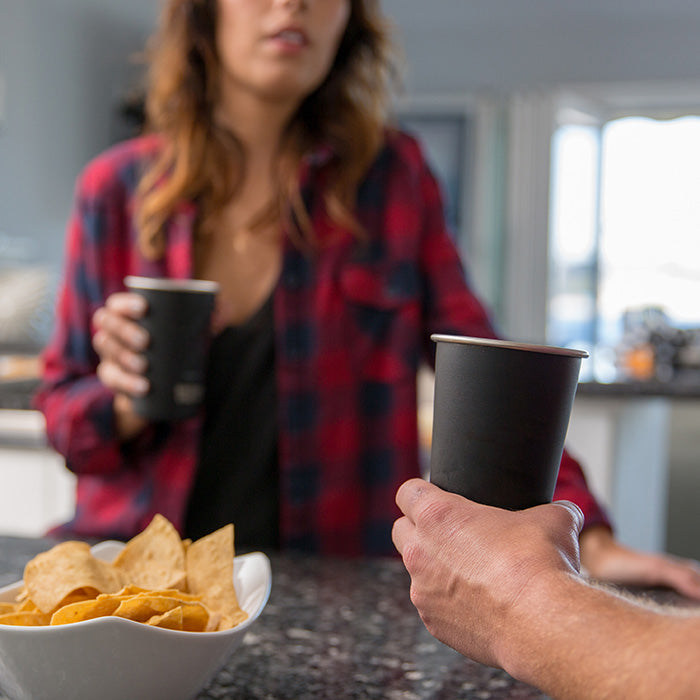 16oz-pint-cup-d3 16ounce_steel_pint_cup_black_party_lifestyle_e7c4b89f-bee2-44df-bb63-bc286febb421.jpg