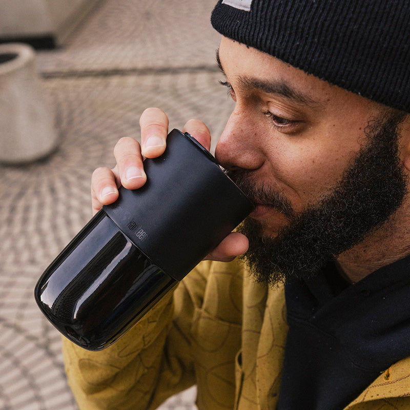 16oz-rise-tumbler-i5 16oz_rise_tumbler_black_man_drink_square.jpg