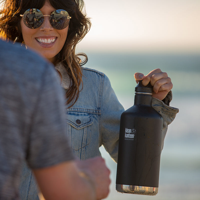 64oz-classic-with-loop-cap-v8 64oz_insulated_classic_black_beach_girl_hand_square.jpg