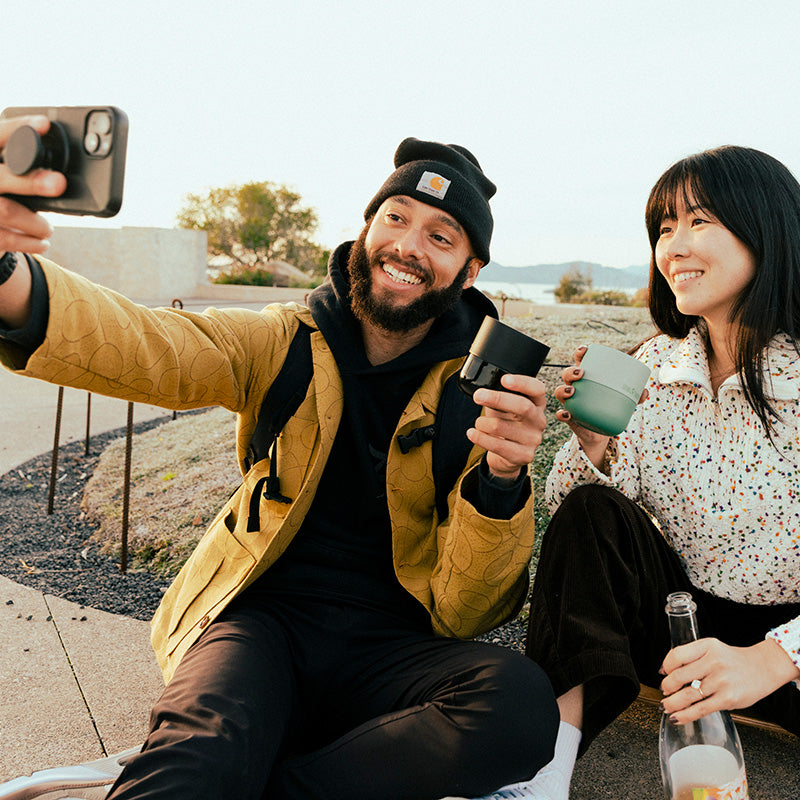 bring-your-own-party-kit-tumblers-and-cocktails-n6 8oz_rise_lowball_black_iceberg_couple_selfie_city_square.jpg