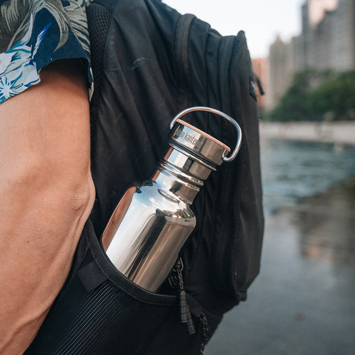 27oz-reflect-with-bamboo-cap-x5 K27SSLRF-MS-BAMBOO_reflect-bottle_backpack_lifestyle.jpg